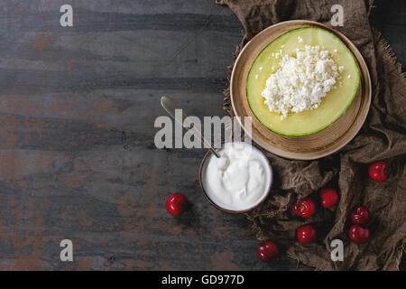 Cottage cheese in melon Stock Photo