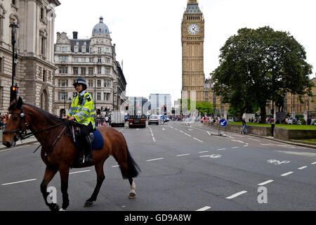 Mounted British police on patrol near Parliament Square London with Big Ben a London landmark in the background Stock Photo