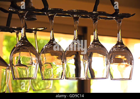 Glasses of wine hanging in a bar Stock Photo