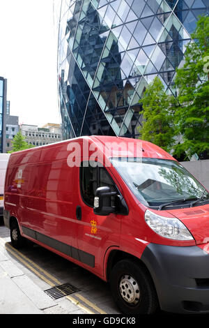 A Royal Mail delivery van parked in the street in front of The Gerkin City of London. Stock Photo