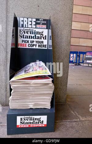 A free Evening Standard newspaper dispensing stand in a London street Stock Photo