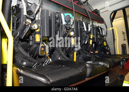 fire service. UK. Great Britain. rear of a fire engine showing firefighters gear ready to deploy Stock Photo