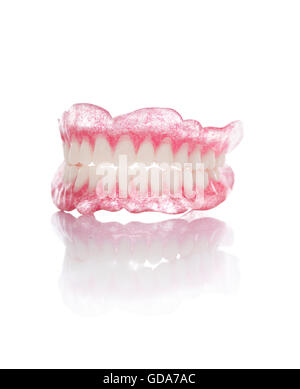 A Set of Artificial Dentures Isolated on White Background Stock Photo