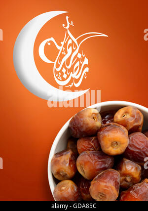 Ramadan Fasting Dates with Crescent over Vivid Background Stock Photo