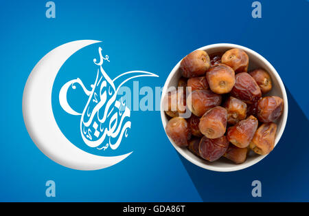 Ramadan Fasting Dates with Crescent over Blue Vivid Background Stock Photo
