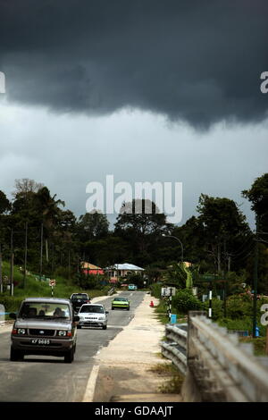 a road by a storm near the city of Bandar seri Begawan in the country of Brunei Darussalam on Borneo in Southeastasia. Stock Photo