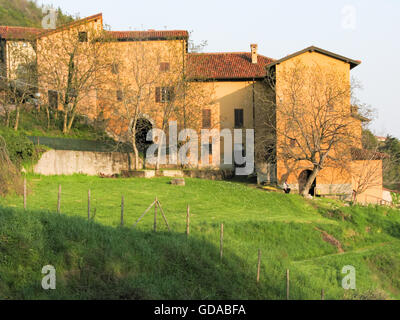 Italy, Lombardy, Provincia di Lecco, residential houses on the mountain in the evening sunlight, starting point Camporeso of the hike Stock Photo