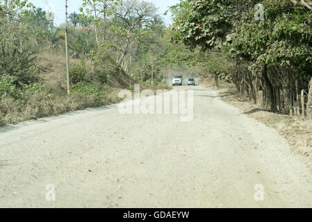 Costa Rica, Guanacaste, oncoming traffic, overtaking maneuver on the gravel road Stock Photo