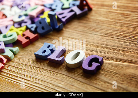 BLOG  - word made from multicolored child toy  letters on wooden  background Stock Photo