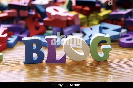 BLOG  - word made from multicolored child toy  letters on wooden  background Stock Photo