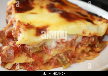 Homemade lasagne, home cooking, homemade cheese sauce, bolognese sauce, mince, onions, peppers, garlic, Italian food Stock Photo