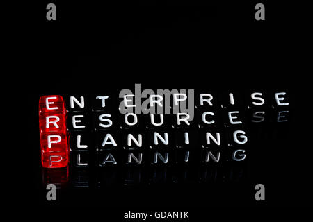 ERP Enterprise Resource Planning writen on black  dices Stock Photo