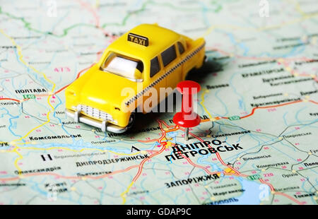 Close up of  Dnepropetrovsk  ,Ukraine , map with red pin and a taxi toy Stock Photo