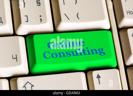 Green  online  consulting button on white keyboard Stock Photo