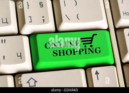 A keyboard with a green  button - Online Shopping Stock Photo
