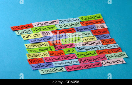 welcome Word Cloud printed on paper on blue font Stock Photo