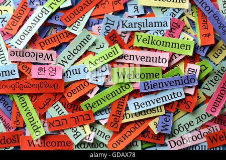 welcome Word Cloud printed on paper on blue font Stock Photo