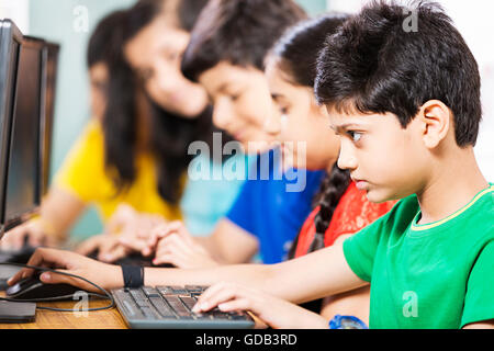 5 kids Girls and Boys School Student Sitting Classroom Computer Studying Stock Photo