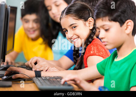 5 kids Girls and Boys School Student Sitting Classroom Computer Studying Stock Photo