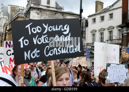 Young people protester crowd woman & voting poster 'Too Young to Vote and Not Consulted' at Brexit remain march in London UK 23 June 2016 KATHY DEWITT Stock Photo