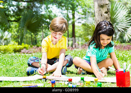 2 indian Kids girl and boy friends Students park Drawing Painting Stock Photo