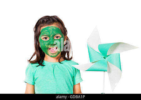 1 indian Kid girl face paint Standing and showing Pinwheel Stock Photo