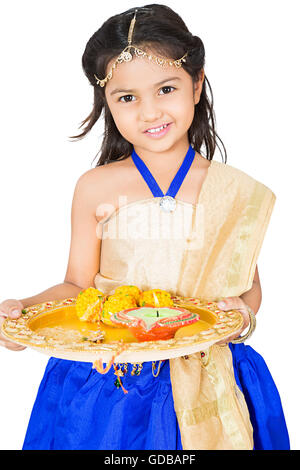 1 indian Kid girl Raksha Bandhan Festival standing plate holding Anticipation Stock Photo