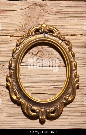 golden frame on wood texture background Stock Photo