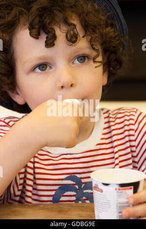 Young boy eating ice cream Stock Photo