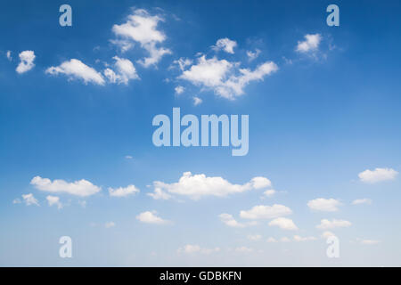 White clouds in deep blue sky, natural background photo Stock Photo