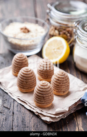 Traditional bee nest cake and ingredients on wooden background Stock Photo