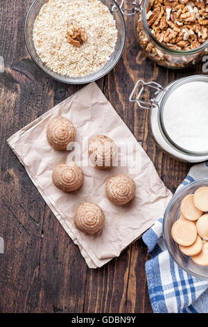Traditional bee nest cake and ingredients on wooden background Stock Photo