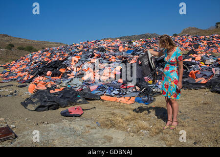 life jackets used by refugees to cross from Turkey to Greece. They are collected and dumped at the waste pit at Lesbos