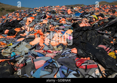 life jackets used by refugees to cross from Turkey to Greece. They are collected and dumped at the waste pit at Lesbos