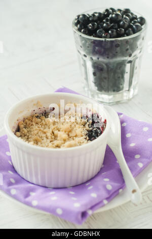 Blueberry crumble, pie, in a small dish. Stock Photo