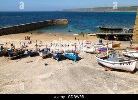 Fishing boats and breakwater in the harbour, Sennan Cove, Land's End, Cornwall, England, UK Stock Photo