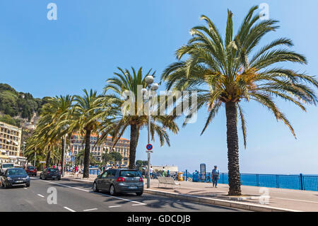 People walk on Promenade des Anglais in City of Nice, Cote D'azur, France Stock Photo