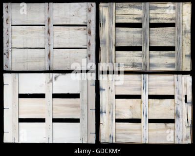 Back side closeup view of aged used dirty wooden fruits boxes set. Isolated on black Stock Photo