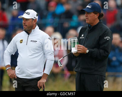 England's Lee Westwood (left) and USA's Phil Mickelson on the 4th green during day two of The Open Championship 2016 at Royal Troon Golf Club, South Ayrshire. Stock Photo