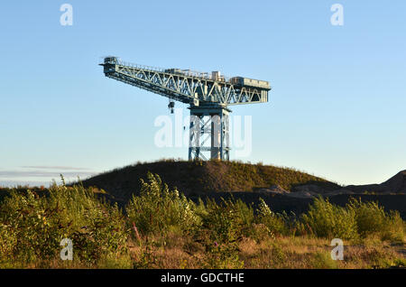 Waste Ground. The Titan Crane on the site of the former John Brown's shipyard in Clydebank surrounded by piles of demolition rubble. Stock Photo