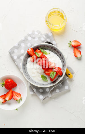 breakfast rice with strawberries, food top view Stock Photo