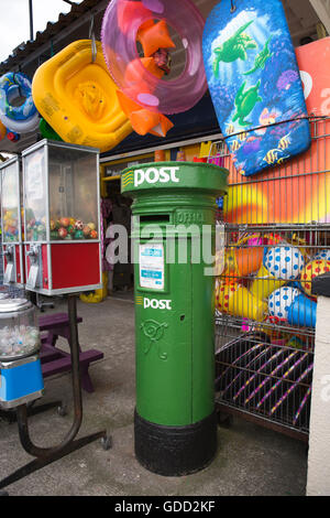 Ireland, Co Galway, Salthill, Promenade, Victorian green painted post box outside beach supplies shop Stock Photo