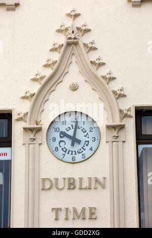 Ireland, Co Galway, Galway, Shop Street, Dublin Time, sign and clock above Galway Camera Centre photographic shop Stock Photo