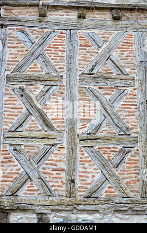 Traditional half timbered wall with simple saltires and brick filling Stock Photo