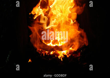 BLACKSMITH FORGE, IRON IN FIRE TO PRODUCE HORSESHOE, NORMANDY Stock Photo