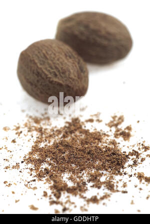 Nutmegs, myristica fragrans, Fruits and Powder against White Background Stock Photo