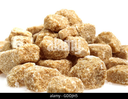Brown Sugar, Cubes against White Background Stock Photo
