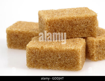 Cubes of Brown Sugar against White Background Stock Photo