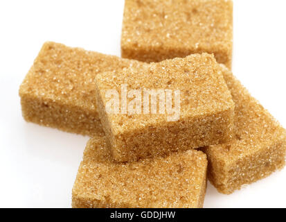 Brown Sugar, Cubes against White Background Stock Photo