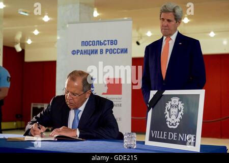 Moscow, Russia. 15th July, 2016. Russian Foreign Minister Sergey Lavrov signs a book of condolences as U.S Secretary of State John Kerry looks on at the French Embassy July 15, 2016 in Moscow, Russia. The two Ministers each laid a bouquet of roses at a makeshift memorial in memory of the victims of the Bastille Day terrorist truck attack in Nice, France. Credit:  Planetpix/Alamy Live News Stock Photo